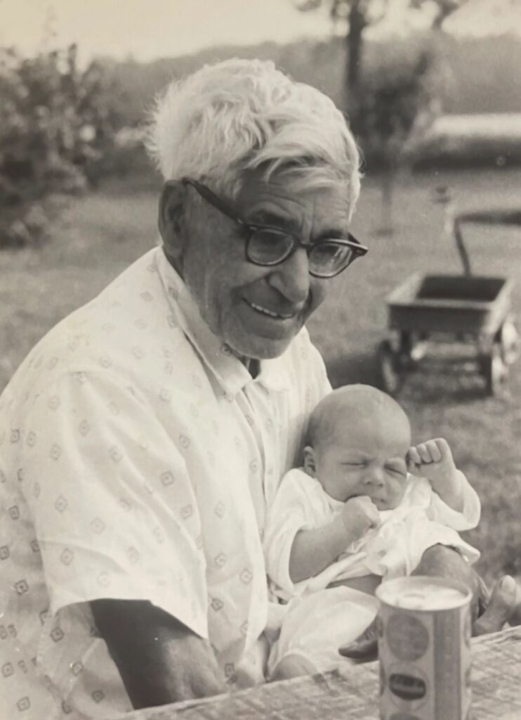 Grampa Jesse Bowman holding his great grandson James Bruchac (1968). Photograph by Carol Bruchac.